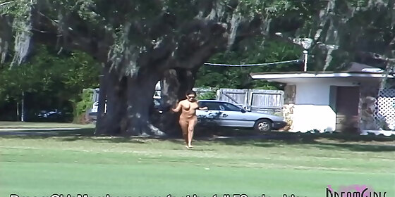 wild latina streaks across a public golf course