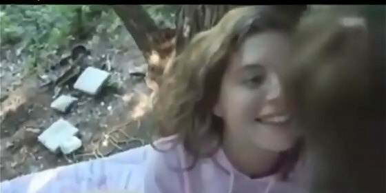 cute teens make sextape perched precariously in the woods