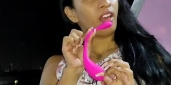 sexy latina paying with sex toy in public