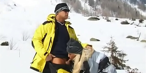 sharon bright is on a snowy mountain giving a ski instructor a blowjob