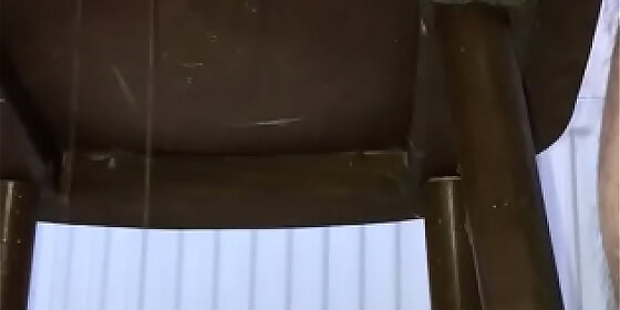 peeing on the chair under the table