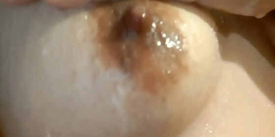 my girlfriend touches her huge breasts while taking a bath