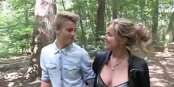 young guy fucks an adult lady with beautiful boobs right in the forest