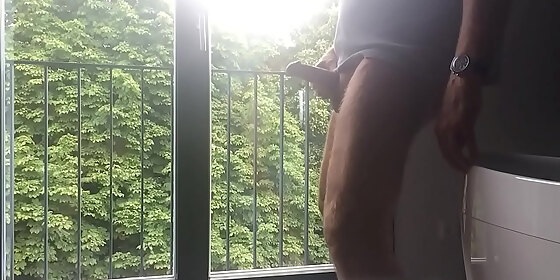 cumshot infront of a window