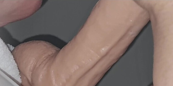 riding a huge dildo till orgasm while blowing clouds on his dick