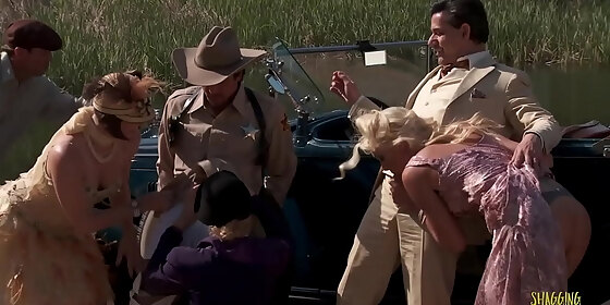 criminals have fun during an outdoors group sex session with the blonde and brunette milfs with big boobs