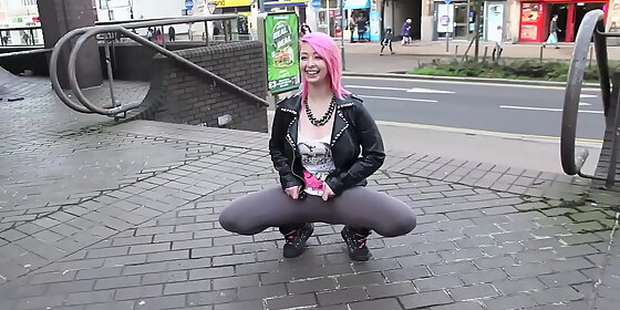 beautiful and very slutty slut shows her ass in public while pissing between her legs