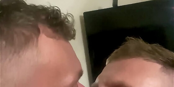 two guys men passionately kissing