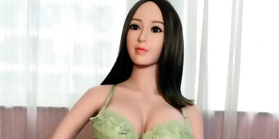 hot asian love doll in green bikini with massive tits ready for doggystyle