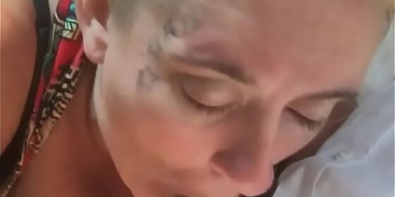 trailer trash whore flashes her massive tits in public during a blowjob where she lets a guy cum in her mouth