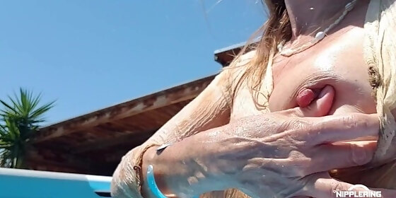 nippleringlover horny milf see through wet shirt in pool padlocks in extreme pierced nipples