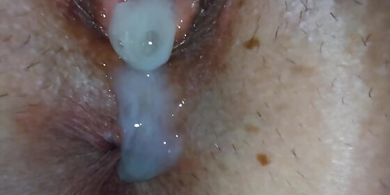extreme close up cum flowing and dripping into pussy