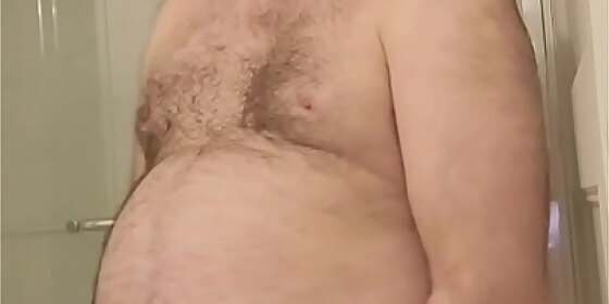 nude martin lavalle sodomizes himself with a red dildo and compares it with his black chastity device