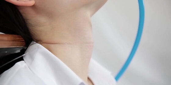 the movement of the throat of a woman drinking water