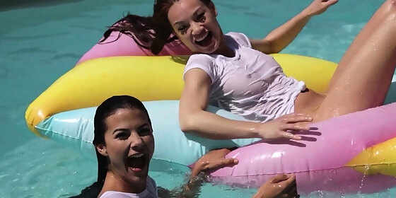 lesbian girlfriends having fun at a pool