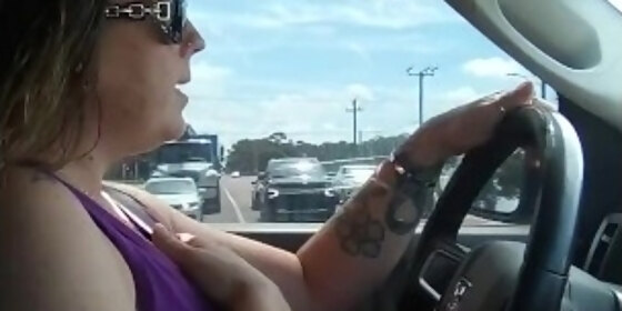 cute milf driving pickup truck in sunglasses and chilling