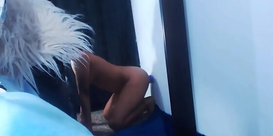 ebony fucks dildo stuck to the wall on webcam