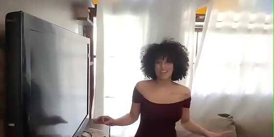 hot mulata brunette cleaning the room curtain