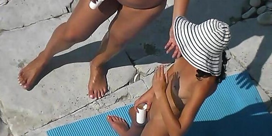 nudist teenies tanning nude at beach