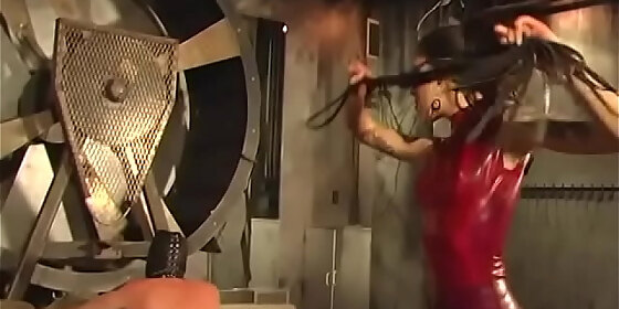 sexy dominatrix in red leather makes a guy do her wishes
