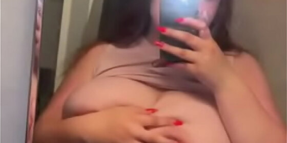 big titty woman showing off her big breasts