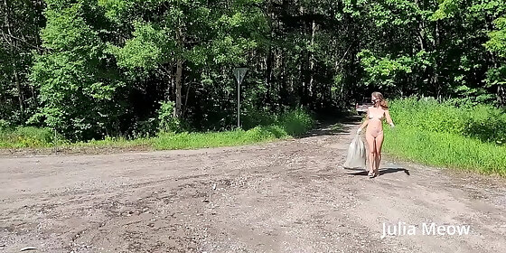 naked girl pick up litter near the road