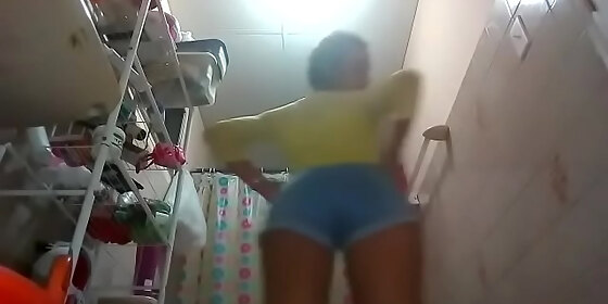 strips naked in the bathroom