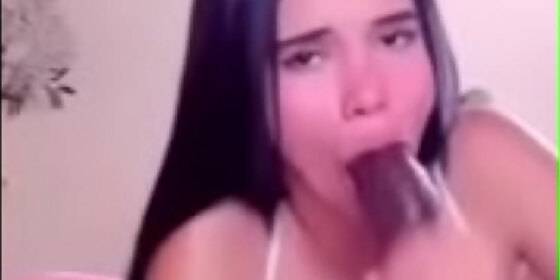 sucking a black dildo