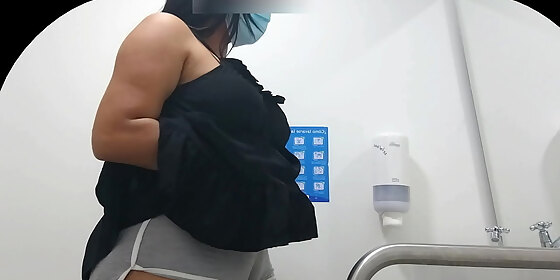 hidden camera capturing cameltoe of girl with big ass in public bathroom