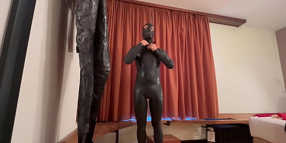preparations for an evening dressed in latex