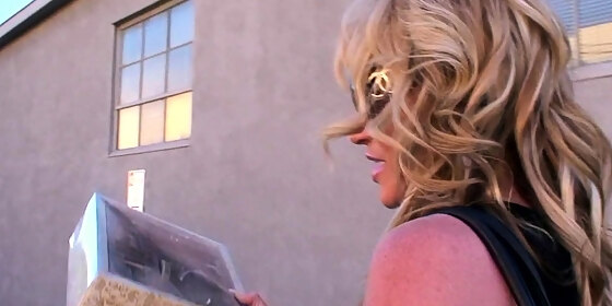 blonde is flashing her big boobs in the outdoors
