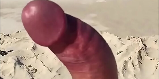 wanking curved cock at the beach slow motion