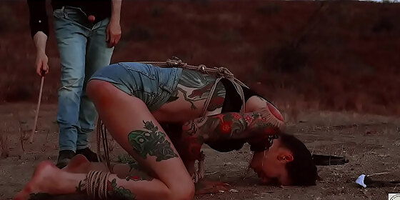 ass eating bondage slave cries while her feet get caned outdoors in the dirt rocky emerson