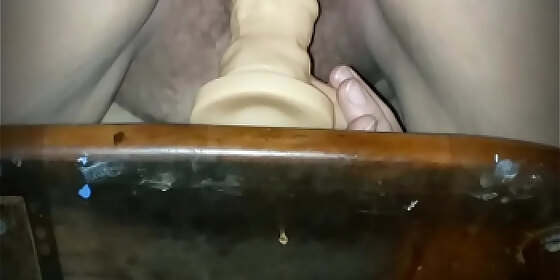 riding dildo spreading her lips and gaping pussy