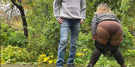 watching a hot milf with a fat ass piss in pantyhose outdoors