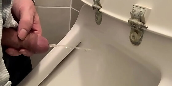 me pissing in a urinal