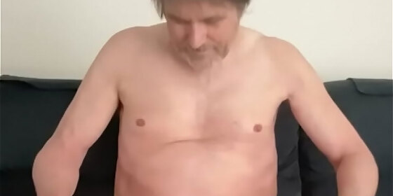 nudeguy57 playing with his cock and balls on the couch in his living room and showing off his stiff cock at the end