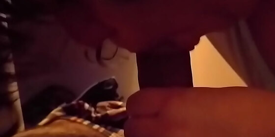 giving a shy blowjob