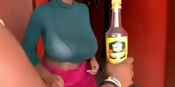 ghana girl opens a bottled d with her breasts