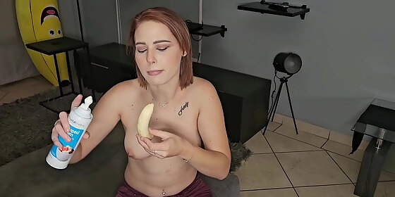 hot topless pale tattooed slut deepthroats on a banana with whipped cream