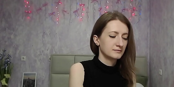 brunette amateur with naked shoulders on webcam