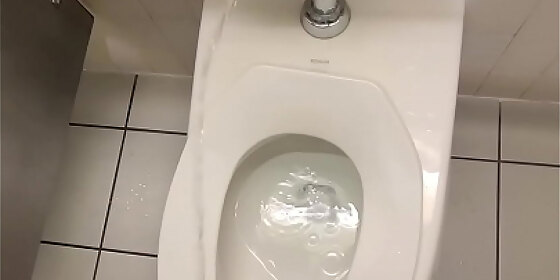 inappropriately peeing all over and around a public toilet at the local movie theater bathroom