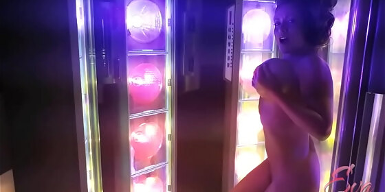 kinky milf eva notty teases her massive tits while tanning