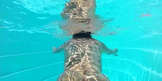 tattooed honey taking a large prick at the pool
