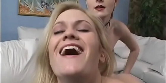blonde and brunette young sluts are very happy when lick each others twats and fuck with strapon