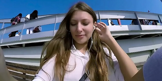 talia mint plays in public with remote control toy over the phone with fan