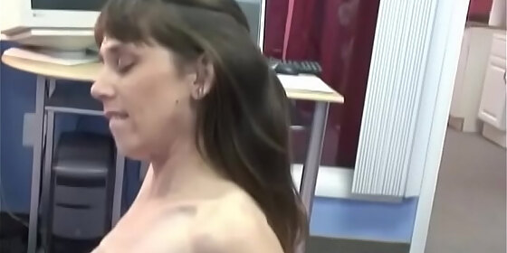 petite brunette smiles as she gets fucked doggystyle on computer office floor