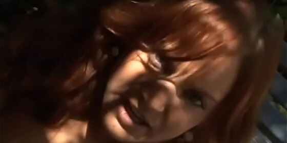 playful redhaired hottie gabriella banks took off her lingerie to play with her muff rubbing it with glass dildo in the shade of a tree