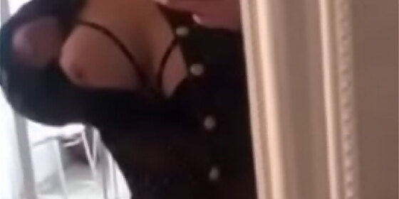 beautiful adult blonde posing in front of a mirror