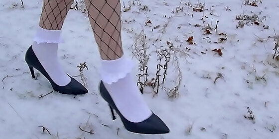 high heels and white frilly socks in the snow